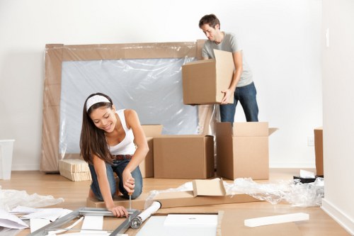Furniture and boxes being loaded into a moving van